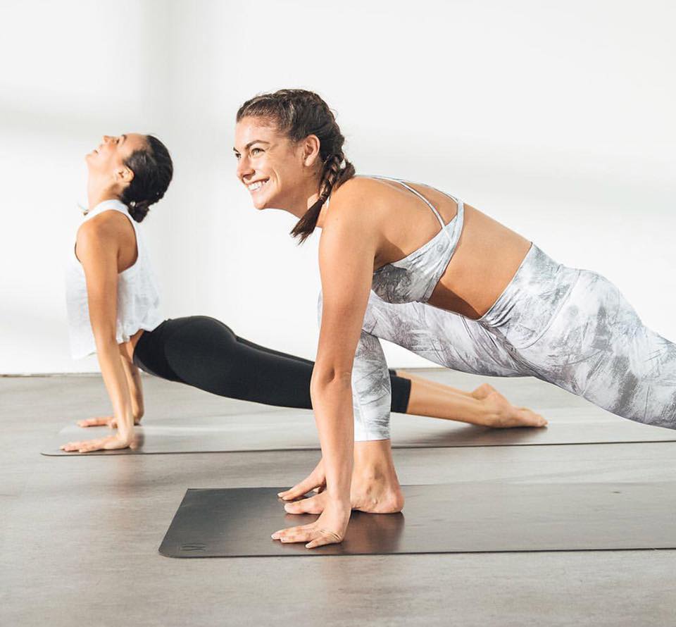 Premium Photo  Two women in athletic clothing posing for a photo.